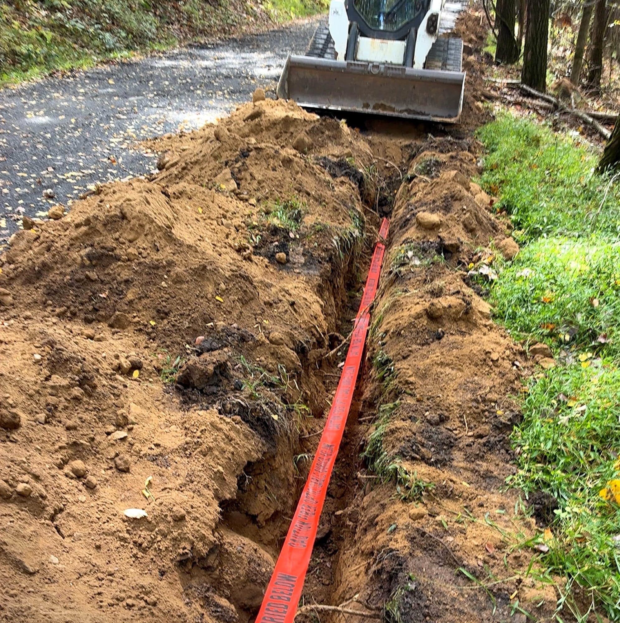 Open trench with conduit for a fiber run